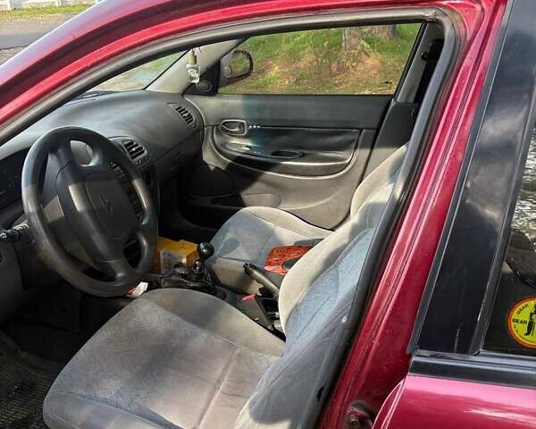 Красный Дэу Нубира, объемом двигателя 1.6 л и пробегом 190 тыс. км за 2350 $, фото 6 на Automoto.ua