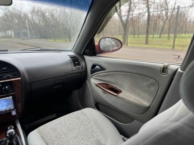 Червоний Деу Нубіра, об'ємом двигуна 2 л та пробігом 270 тис. км за 1299 $, фото 14 на Automoto.ua