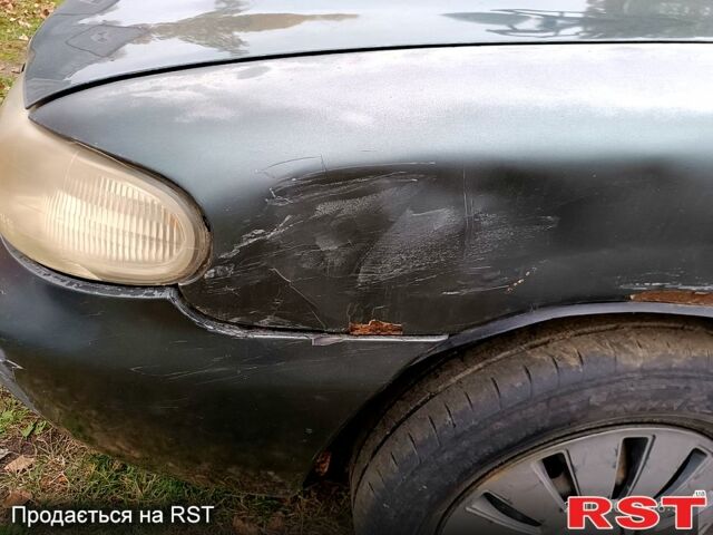 Серый Дэу Нубира, объемом двигателя 1.6 л и пробегом 350 тыс. км за 1100 $, фото 3 на Automoto.ua