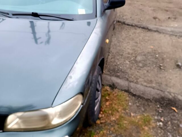 Серый Дэу Нубира, объемом двигателя 1.6 л и пробегом 350 тыс. км за 1100 $, фото 2 на Automoto.ua