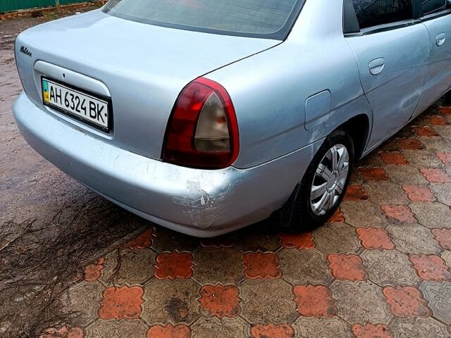 Серый Дэу Нубира, объемом двигателя 1.6 л и пробегом 300 тыс. км за 1410 $, фото 3 на Automoto.ua