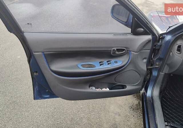 Синій Деу Нубіра, об'ємом двигуна 2 л та пробігом 180 тис. км за 2999 $, фото 27 на Automoto.ua