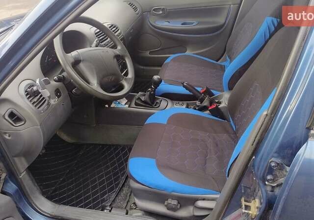 Синій Деу Нубіра, об'ємом двигуна 2 л та пробігом 180 тис. км за 2999 $, фото 28 на Automoto.ua