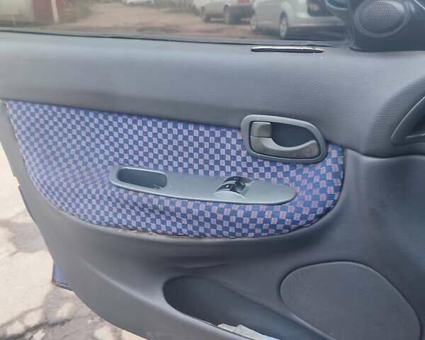 Синій Деу Нубіра, об'ємом двигуна 2 л та пробігом 250 тис. км за 1099 $, фото 3 на Automoto.ua