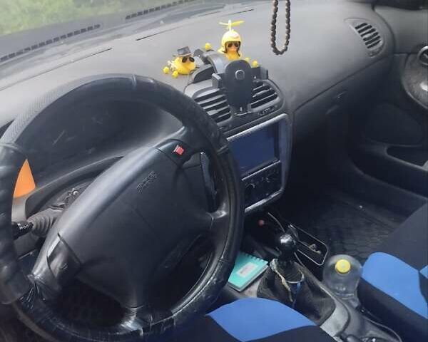 Синій Деу Нубіра, об'ємом двигуна 1.6 л та пробігом 330 тис. км за 1500 $, фото 9 на Automoto.ua