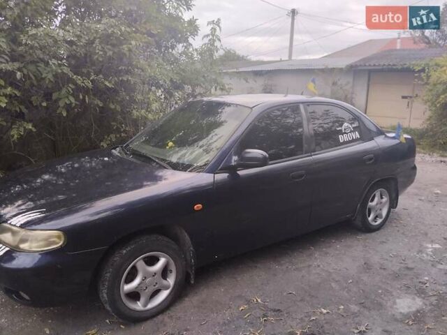 Синій Деу Нубіра, об'ємом двигуна 1.6 л та пробігом 330 тис. км за 1500 $, фото 3 на Automoto.ua