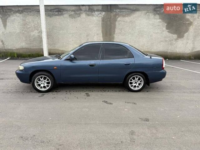 Синий Дэу Нубира, объемом двигателя 1.6 л и пробегом 300 тыс. км за 1294 $, фото 5 на Automoto.ua