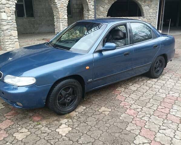 Синий Дэу Нубира, объемом двигателя 1.6 л и пробегом 310 тыс. км за 1800 $, фото 1 на Automoto.ua