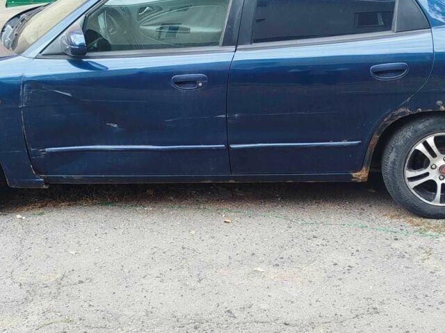 Синій Деу Нубіра, об'ємом двигуна 2 л та пробігом 200 тис. км за 1390 $, фото 4 на Automoto.ua