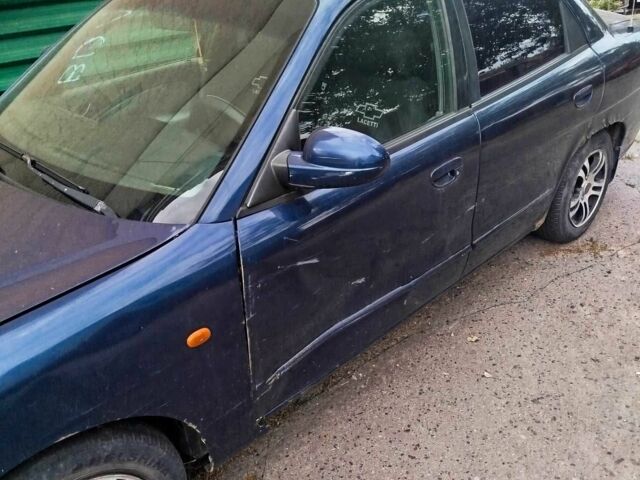 Синій Деу Нубіра, об'ємом двигуна 2 л та пробігом 200 тис. км за 1390 $, фото 5 на Automoto.ua