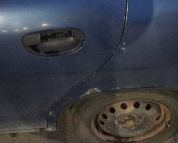 Синій Деу Нубіра, об'ємом двигуна 1.6 л та пробігом 275 тис. км за 1399 $, фото 3 на Automoto.ua