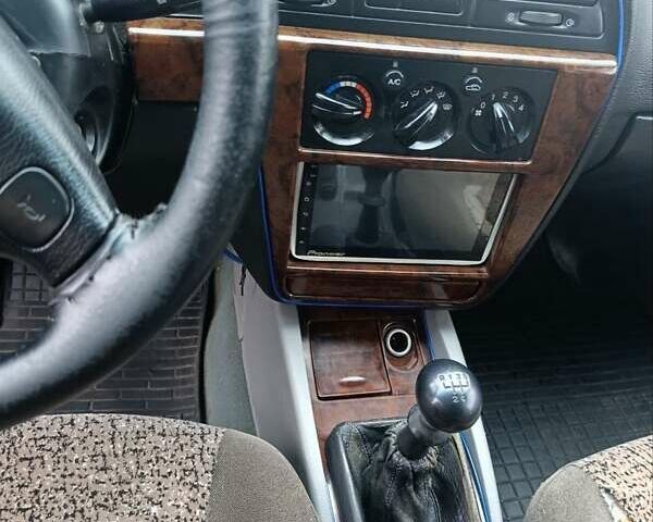 Синий Дэу Нубира, объемом двигателя 2 л и пробегом 312 тыс. км за 2200 $, фото 5 на Automoto.ua