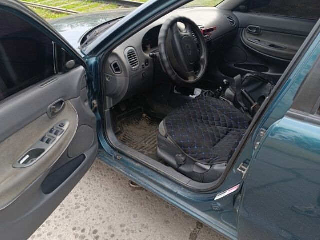 Зеленый Дэу Нубира, объемом двигателя 2 л и пробегом 435 тыс. км за 1700 $, фото 3 на Automoto.ua