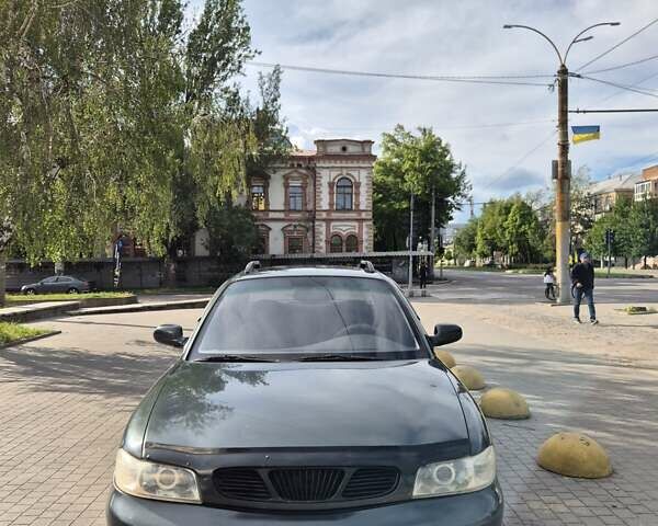 Зеленый Дэу Нубира, объемом двигателя 2 л и пробегом 220 тыс. км за 2200 $, фото 2 на Automoto.ua