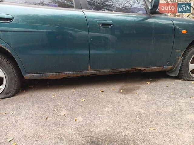 Зеленый Дэу Нубира, объемом двигателя 1.6 л и пробегом 260 тыс. км за 1300 $, фото 5 на Automoto.ua