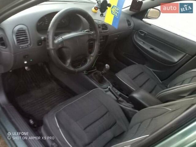 Зеленый Дэу Нубира, объемом двигателя 1.6 л и пробегом 180 тыс. км за 1900 $, фото 2 на Automoto.ua