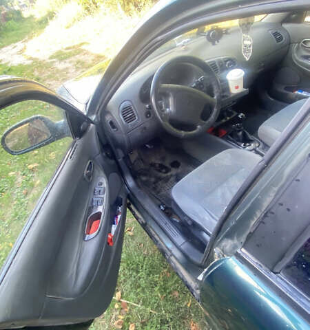 Зеленый Дэу Нубира, объемом двигателя 1.6 л и пробегом 350 тыс. км за 1300 $, фото 4 на Automoto.ua