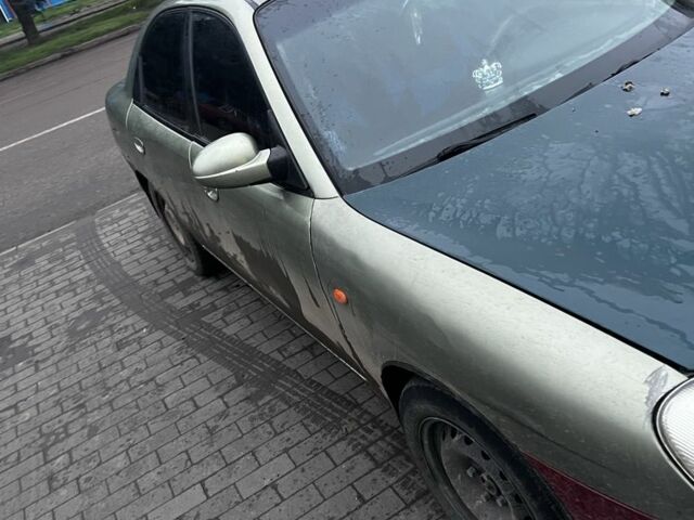 Зеленый Дэу Нубира, объемом двигателя 2 л и пробегом 317 тыс. км за 1800 $, фото 5 на Automoto.ua