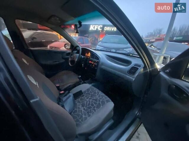 Чорний Деу Сенс, об'ємом двигуна 1.35 л та пробігом 345 тис. км за 1699 $, фото 8 на Automoto.ua