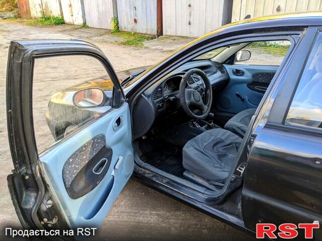 Черный Дэу Сенс, объемом двигателя 1.3 л и пробегом 230 тыс. км за 1250 $, фото 3 на Automoto.ua