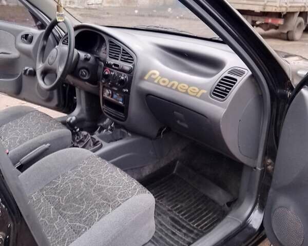 Черный Дэу Сенс, объемом двигателя 1.3 л и пробегом 238 тыс. км за 1800 $, фото 3 на Automoto.ua