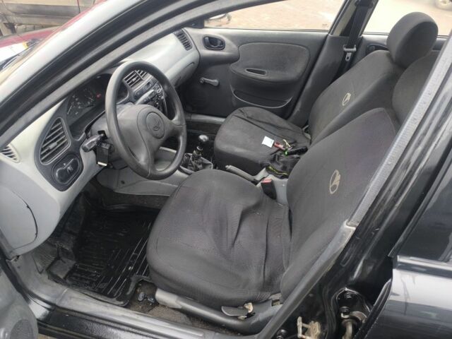 Черный Дэу Сенс, объемом двигателя 1.5 л и пробегом 204 тыс. км за 1000 $, фото 2 на Automoto.ua