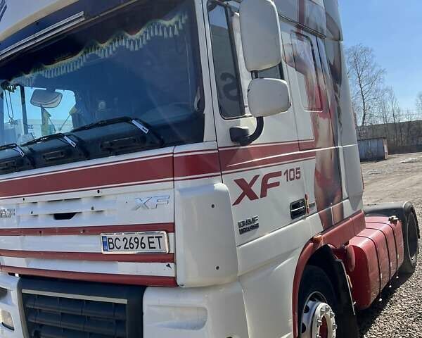 Красный Даф XF 105, объемом двигателя 12.9 л и пробегом 200 тыс. км за 10000 $, фото 1 на Automoto.ua