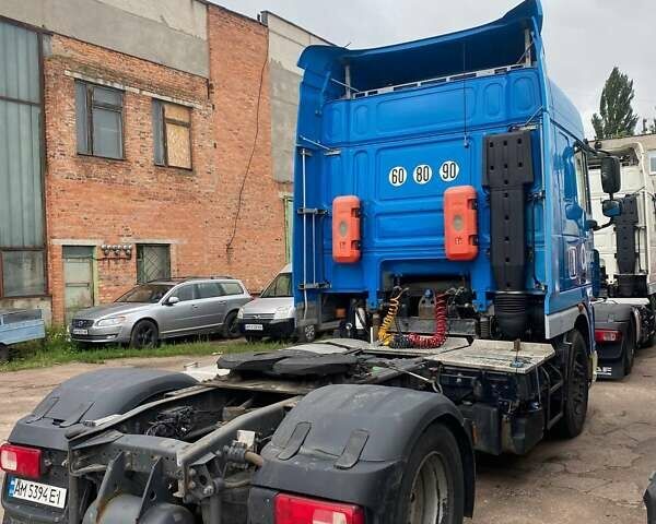 Синий Даф XF 105, объемом двигателя 12.9 л и пробегом 875 тыс. км за 15000 $, фото 2 на Automoto.ua