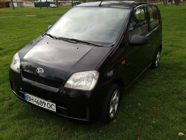 Черный Дайхатсу Куоре, объемом двигателя 1 л и пробегом 122 тыс. км за 3500 $, фото 1 на Automoto.ua