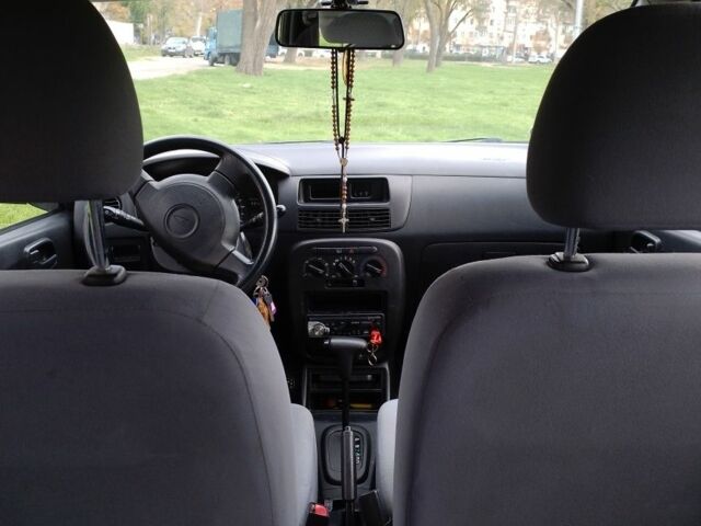 Черный Дайхатсу Куоре, объемом двигателя 1 л и пробегом 122 тыс. км за 3500 $, фото 3 на Automoto.ua