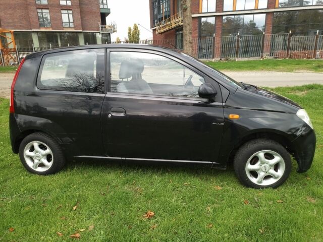Черный Дайхатсу Куоре, объемом двигателя 1 л и пробегом 122 тыс. км за 3500 $, фото 2 на Automoto.ua