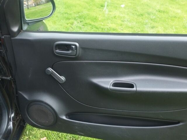 Черный Дайхатсу Куоре, объемом двигателя 1 л и пробегом 122 тыс. км за 3500 $, фото 6 на Automoto.ua