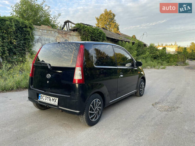 Чорний Дайхатсу Cuore, об'ємом двигуна 0.99 л та пробігом 185 тис. км за 3200 $, фото 3 на Automoto.ua