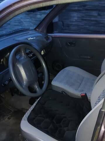 Фиолетовый Дайхатсу Куоре, объемом двигателя 0.85 л и пробегом 155 тыс. км за 2000 $, фото 5 на Automoto.ua