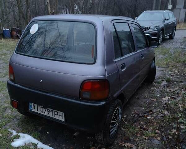 Фиолетовый Дайхатсу Куоре, объемом двигателя 0.85 л и пробегом 155 тыс. км за 2000 $, фото 3 на Automoto.ua