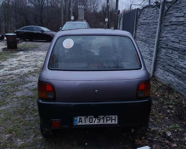 Фиолетовый Дайхатсу Куоре, объемом двигателя 0.85 л и пробегом 155 тыс. км за 2000 $, фото 1 на Automoto.ua