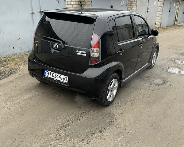 Чорний Дайхатсу Sirion, об'ємом двигуна 1.3 л та пробігом 159 тис. км за 5900 $, фото 4 на Automoto.ua