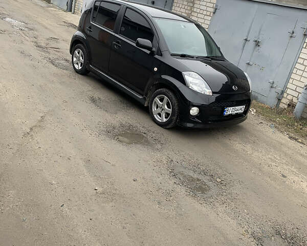 Чорний Дайхатсу Sirion, об'ємом двигуна 1.3 л та пробігом 159 тис. км за 5900 $, фото 2 на Automoto.ua