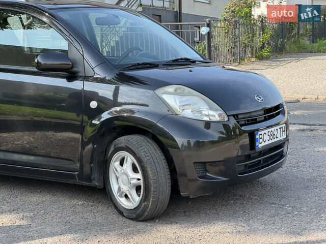 Чорний Дайхатсу Sirion, об'ємом двигуна 1 л та пробігом 116 тис. км за 5299 $, фото 12 на Automoto.ua