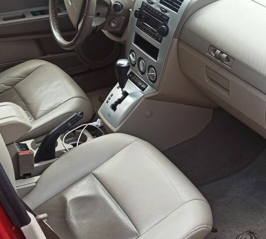 Красный Додж Калибер, объемом двигателя 2 л и пробегом 250 тыс. км за 5700 $, фото 3 на Automoto.ua