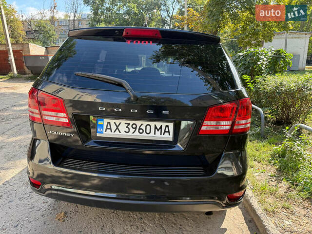 Черный Додж Джорни, объемом двигателя 2.4 л и пробегом 290 тыс. км за 9500 $, фото 1 на Automoto.ua