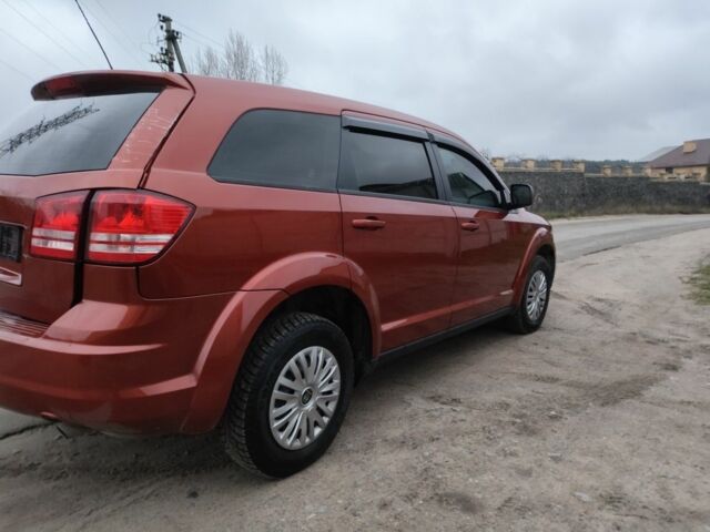 Помаранчевий Додж Джорні, об'ємом двигуна 2.4 л та пробігом 140 тис. км за 5700 $, фото 1 на Automoto.ua