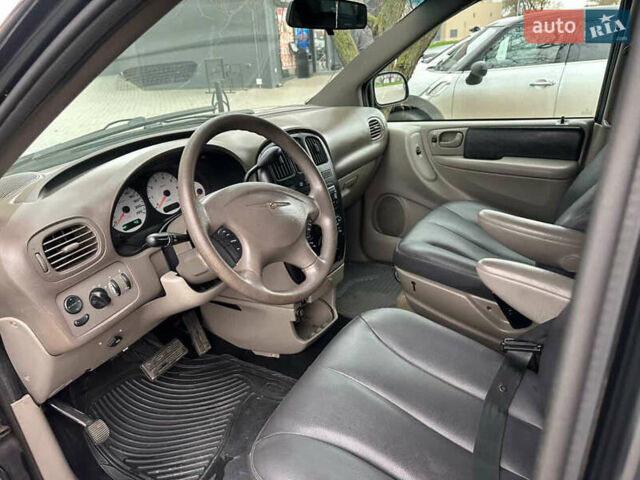 Черный Додж Рам Ван, объемом двигателя 2.5 л и пробегом 200 тыс. км за 2999 $, фото 1 на Automoto.ua