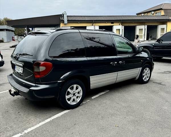 Черный Додж Рам Ван, объемом двигателя 2.5 л и пробегом 225 тыс. км за 5600 $, фото 4 на Automoto.ua