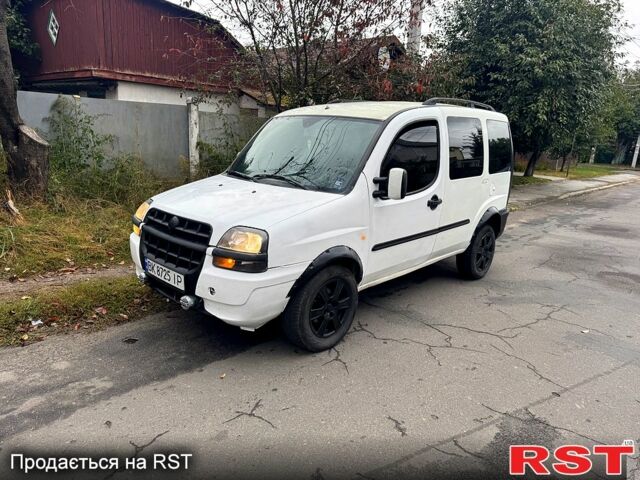 Белый Фиат Добло, объемом двигателя 1.2 л и пробегом 250 тыс. км за 3500 $, фото 1 на Automoto.ua