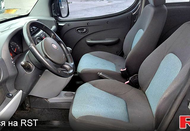 Черный Фиат Добло, объемом двигателя 1.4 л и пробегом 265 тыс. км за 3500 $, фото 6 на Automoto.ua