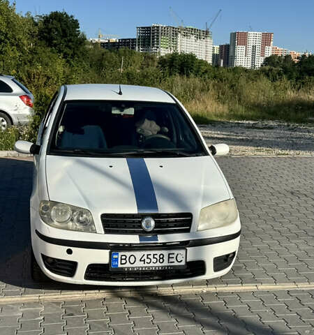 Белый Фиат Пунто, объемом двигателя 1.3 л и пробегом 345 тыс. км за 2800 $, фото 1 на Automoto.ua