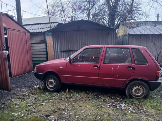 Красный Фиат Уно, объемом двигателя 1.1 л и пробегом 167 тыс. км за 175 $, фото 1 на Automoto.ua