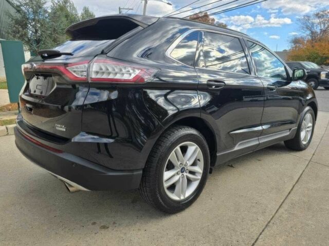 Черный Форд Эдж, объемом двигателя 2 л и пробегом 64 тыс. км за 15700 $, фото 4 на Automoto.ua