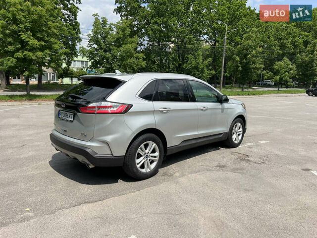 Серый Форд Эдж, объемом двигателя 2 л и пробегом 210 тыс. км за 19000 $, фото 4 на Automoto.ua